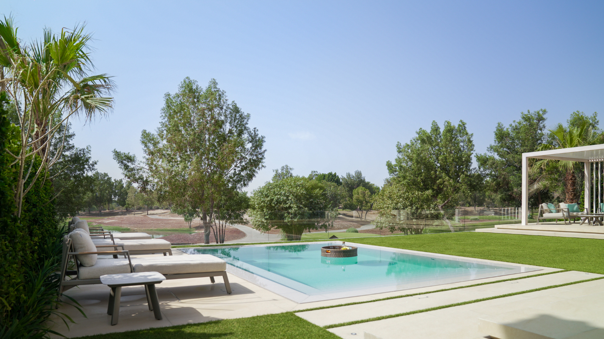 Villa landscaping at Jumeirah Golf Estates, Dubai with an infinity pool and golf course views