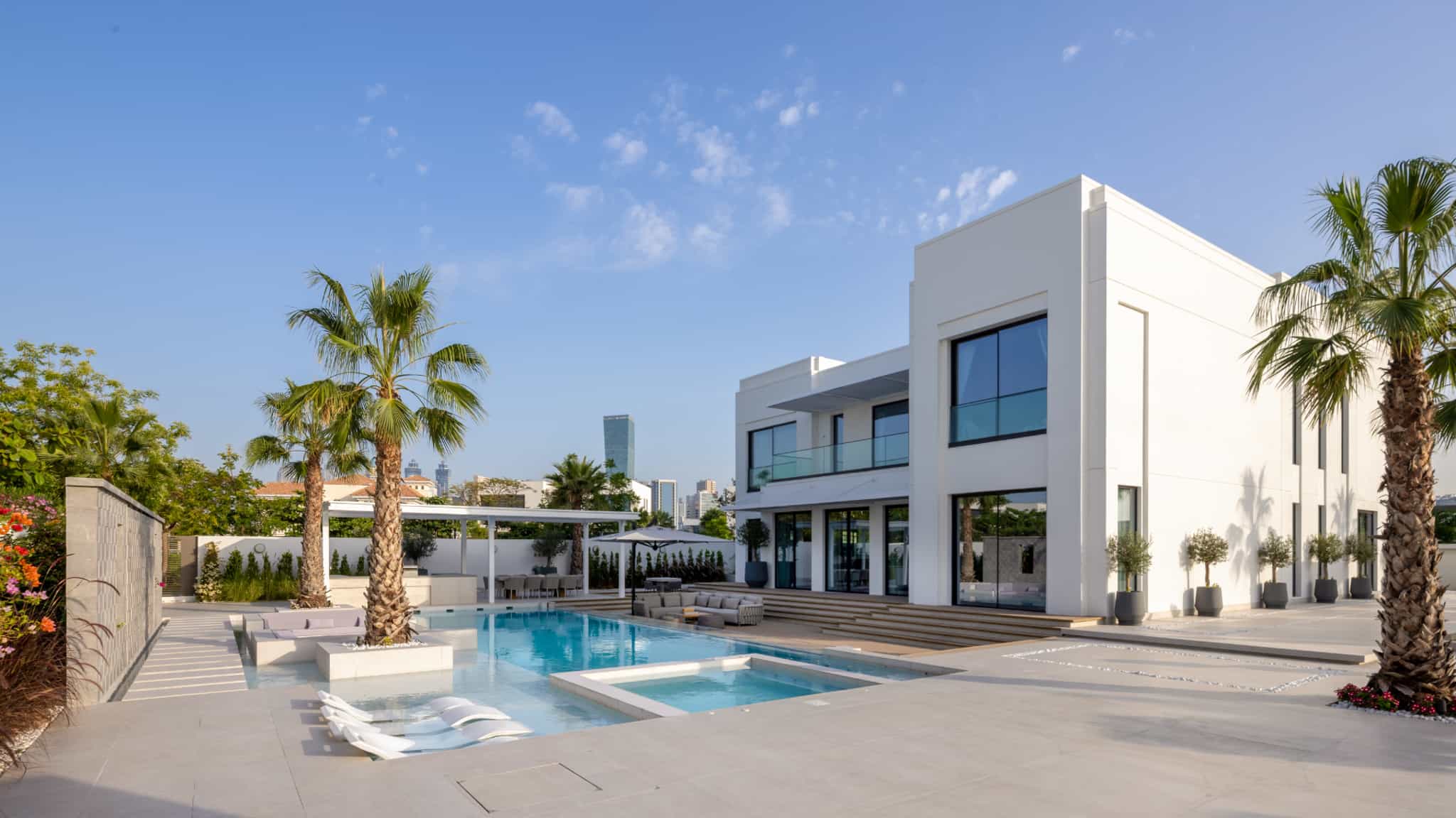 Luxury villa landscaping in MBR City, Dubai with a swimming pool, sunken lounge and fire pit
